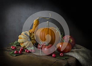 Beautiful ripe pumpkin and tomatoes with apples