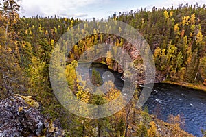 Beautiful river in the autumn forest, view from top, Oulanka national park, Finland
