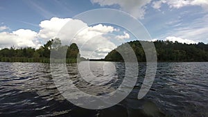 Beautiful river landscape, green nature, clouds, boating POV