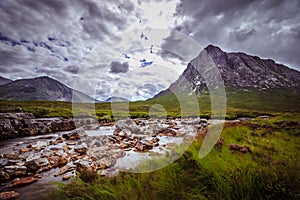 Beautiful river mountain landscape scenery in Glen Coe, Scottish Highlands, Scotland