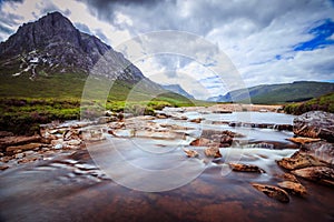 Beautiful river mountain landscape scenery in Glen Coe, Scottish Highlands, Scotland