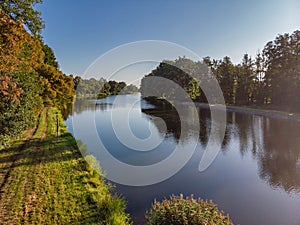 Beautiful river in sunlight and blue morning sky