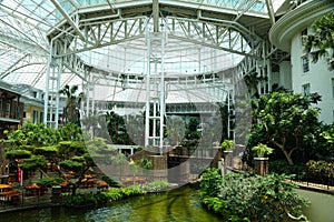 Beautiful river and tropical plants inside of Gaylord Opryland Resort and Convention Center near Nashville, Tennessee, U.S