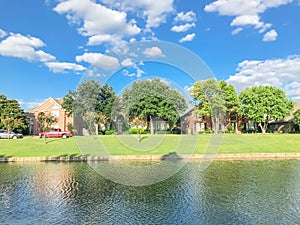 Beautiful riverside residential neighborhood in suburbs Dallas under blue cloud sky