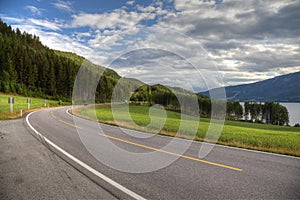 Beautiful mountain road landscape blue sky summer travel empty highway nature asphalt green forest trees Norway rural way journey