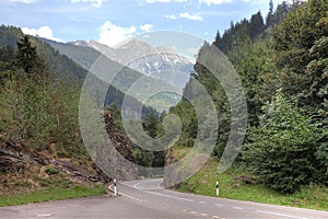 Beautiful mountain road landscape blue sky summer travel empty highway nature asphalt green forest rural way trees scenery swiss photo