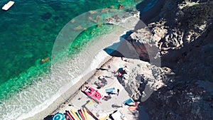 Beautiful rocks on the beach, Elba Island overhead view, Italy. Slow motion