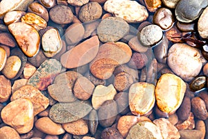 Beautiful rocks and gravels background in clear water stream at