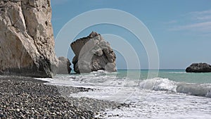 Beautiful rocks and waves on the ocean. Beautiful coastline with turquoise water. Aphrodite's rock a famous tourist