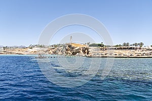 Beautiful rocky coast in resort town of Sharm el Sheikh, Egypt. View from the sea. Egyptian landscape in Sinai