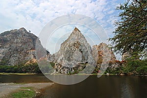 Beautiful Rocky mountain with water lake of khao Ngu Stone Park , Ratchaburi , Thailand.