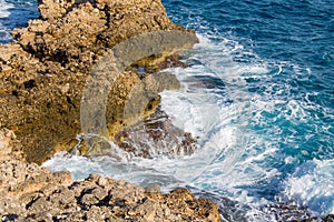 Beautiful rocky ocean coast waves meet rocks