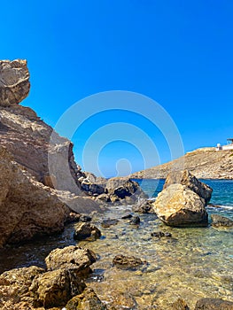 Beautiful rocky scenery near Koubara beach in Ios island Cyclades, Greece photo
