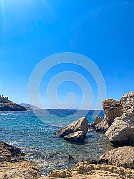 Beautiful rocky scenery near Koubara beach in Ios island Cyclades, Greece photo