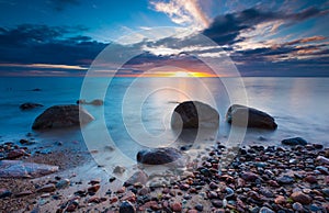 Beautiful rocky sea shore at sunrise or sunset.