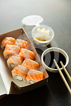 Beautiful rolls and sushi and california roll on a white table. Food delivery. Lunch. Food at home.