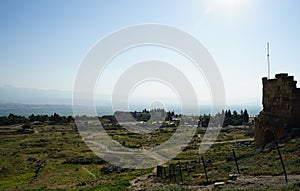 Beautiful Roman ancient ruins of hierapolis Pamukkale with meadow field