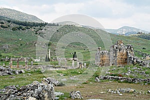 Beautiful Roman ancient ruins of hierapolis Pamukkale with meadow field