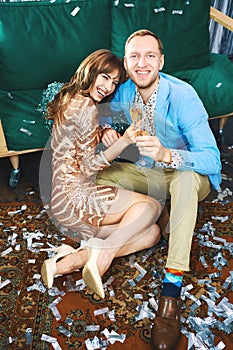 Beautiful romantic couple drinking sparkling wine, enjoying evenrning party, having date at Valentine`s Day.