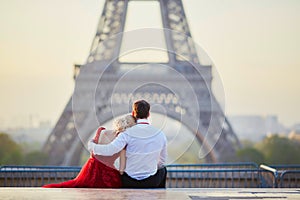 Couple near the Eiffel tower in Paris, France