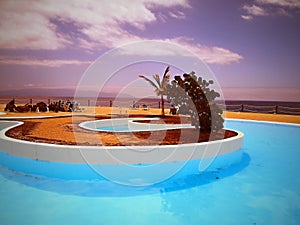 Beautiful romantic place to relax, relax from an interestingly designed swimming pool photo