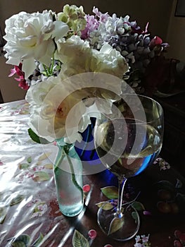 Romantic nostalgia white roses pastel hydrangeas and wine portraits photo