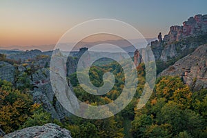 Beautiful romantic sunrise sunset view of the Belogradchick Rocks Belogradchishki skali natural phenomenon in Bulgaria.