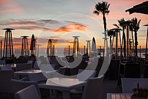 Beautiful Romantic Sunset at the Beach Cafe with Outdoor Patio Heaters