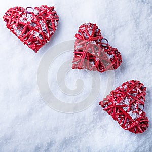 Beautiful romantic vintage hearts on a white frosty snow winter background. Love and St. Valentines Day concept