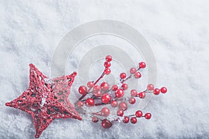 Beautiful romantic vintage red heart with mistletoe berries on a white snow. Christmas, love and St. Valentines Day concept.