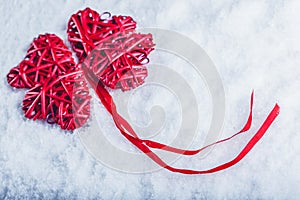 Beautiful romantic vintage red hearts together on a white snow background. Love and St. Valentines Day concept.