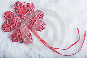 Beautiful romantic vintage red hearts together on a white snow background. Love and St. Valentines Day concept.