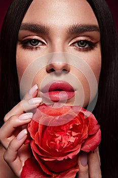 Beautiful romantic young woman with rose. Inspiration of spring and summer. Perfume, cosmetics concept.