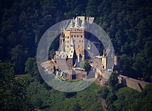Beautiful romantically and magically castle on a hill in the woods.Germany photo