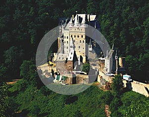 Beautiful romantically and magically castle on a hill in the woods.Germany photo