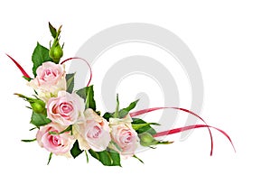 Beautiful rose flowers and pink satin ribbons in a corner compos