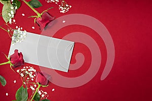Beautiful roses background with love letter and white decorative flowers with copy space, happy valentine`s day, mother`s day, f