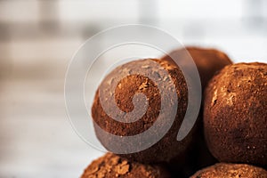 Beautiful round chocolate candy close-up. A round chocolate cake looks like a planet. Tasty, healthy, food