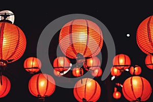 Beautiful round red lantern hanging on old traditional street, concept of Chinese lunar new year festival