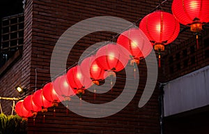 Beautiful round red lantern hanging on old traditional street, concept of Chinese lunar new year festival in Taiwan, close up. The