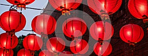 Beautiful round red lantern hanging on old traditional street, concept of Chinese lunar new year festival in Taiwan, close up. The