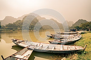 Rafts await villagers by the lake in Vietnam