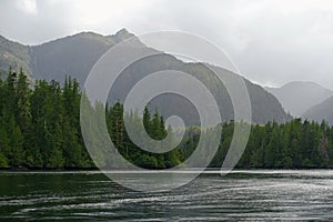 The beautiful rugged landscape of gwaii haanas, with endless forest and mountains, and beautiful calm oceans, in Haida Gwaii