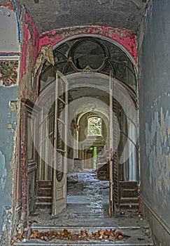 Beautiful Ruined Door Inside an Old Abandoned Mansion photo