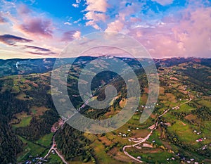 Beautiful rural area at sunset in the Apuseni mountains, Transylvania, Romania as seen from above with a drone. Aerial shot