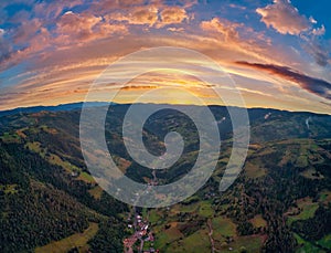 Beautiful rural area at sunset in the Apuseni mountains, Transylvania, Romania as seen from above with a drone. Aerial shot