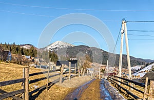 Beautiful rural landscape against the backdrop of the Carpathian Mountains in early spring