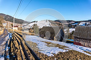 Beautiful rural landscape against the backdrop of the Carpathian Mountains in early spring