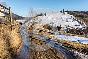 Beautiful rural landscape against the backdrop of the Carpathian Mountains in early spring