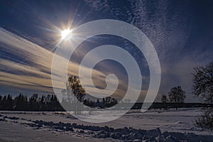 Beautiful rural winter landscape with bright sunshine